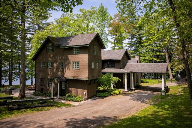 196 Wellington Ln, Springfield, NY 13326 - view of front of home with asphalt driveway, a shingled roof, and a chimney