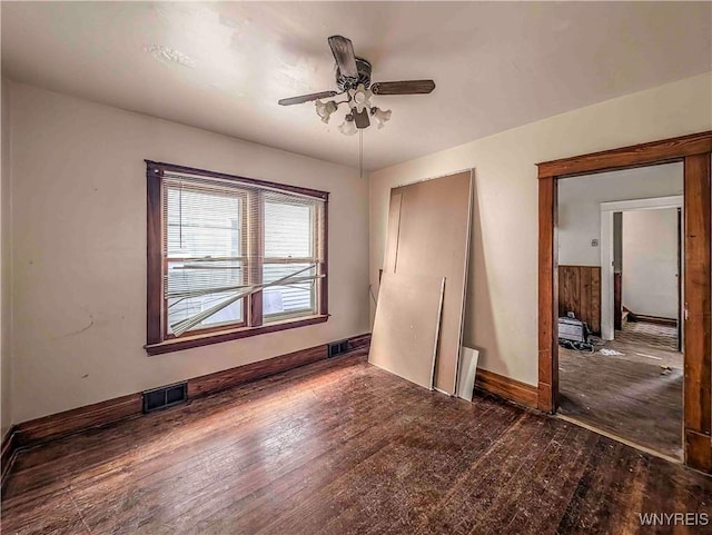 2000 La Salle Ave, Niagara Falls, NY 14301 - unfurnished bedroom with hardwood / wood-style floors, baseboards, visible vents, and ceiling fan