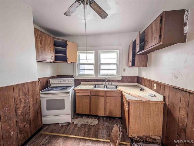 2000 La Salle Ave, Niagara Falls, NY 14301 - kitchen featuring electric range, a wainscoted wall, a sink, dark wood finished floors, and wood walls