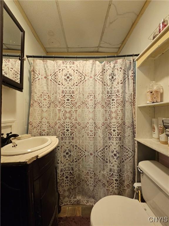 406 S George St, Rome-Inside, NY 13440 - full bath with a shower with shower curtain, toilet, and vanity