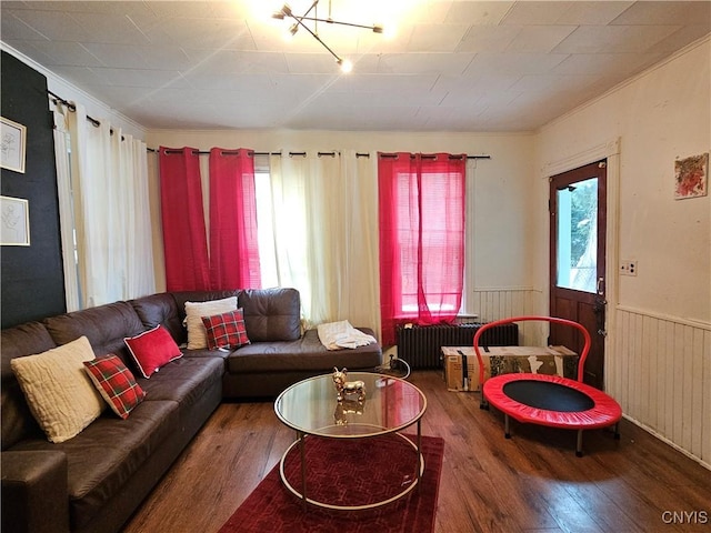 406 S George St, Rome-Inside, NY 13440 - living area featuring wainscoting, radiator, ornamental molding, and wood finished floors