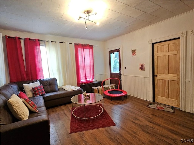 406 S George St, Rome-Inside, NY 13440 - living area with radiator, wood finished floors, and wainscoting