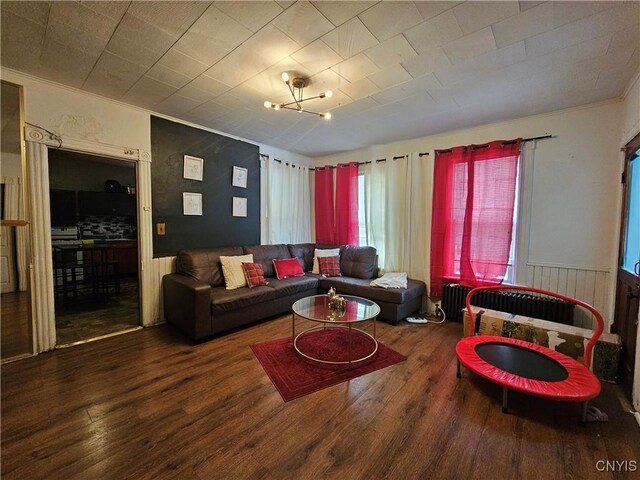 406 S George St, Rome-Inside, NY 13440 - living area with wood finished floors and wainscoting