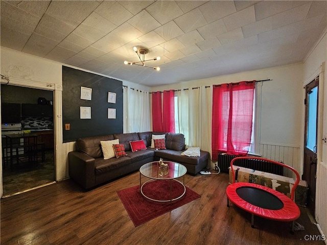 406 S George St, Rome-Inside, NY 13440 - living room featuring a wainscoted wall and wood finished floors