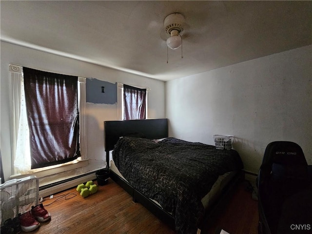 406 S George St, Rome-Inside, NY 13440 - bedroom with ceiling fan, wood finished floors, and a baseboard radiator
