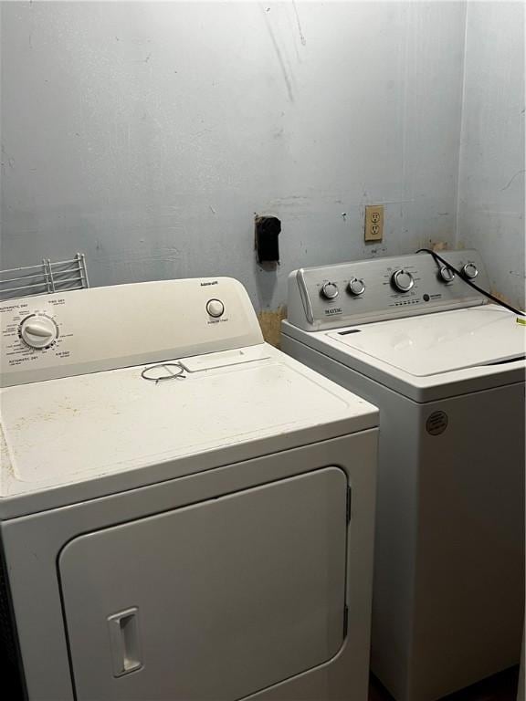 laundry room featuring laundry area and washing machine and clothes dryer