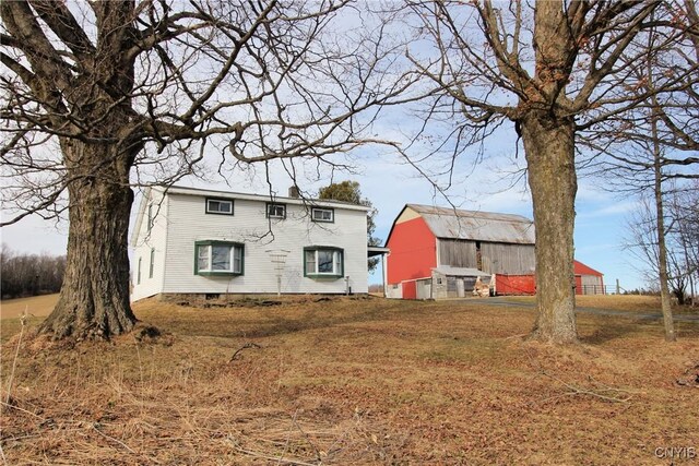 exterior space with a barn and an outdoor structure