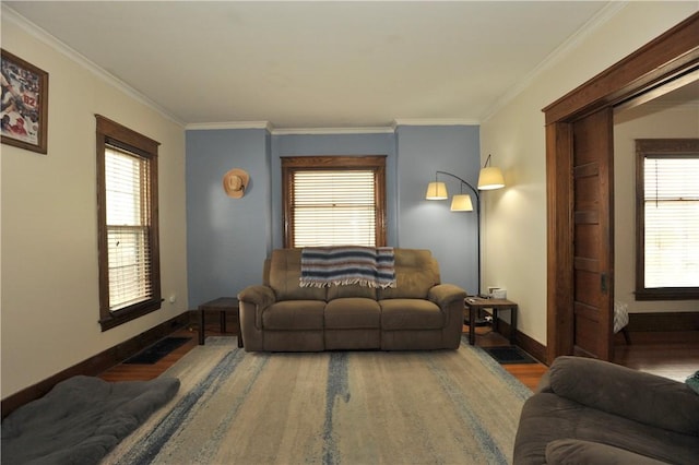 331 W Washington Ave, Elmira-City, NY 14901 - living area with visible vents, baseboards, wood finished floors, and ornamental molding