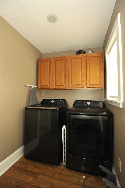 331 W Washington Ave, Elmira-City, NY 14901 - clothes washing area featuring cabinet space, dark wood-type flooring, baseboards, and separate washer and dryer