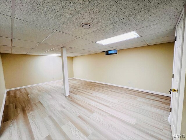5499 Ravensthorpe, Clay, NY 13041 - finished basement with wood finished floors, a drop ceiling, and baseboards