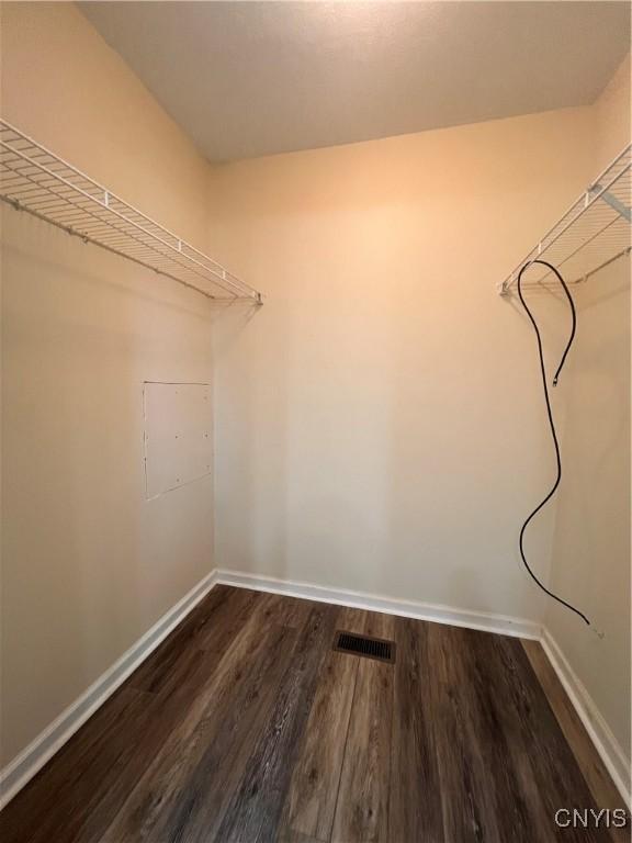 5499 Ravensthorpe, Clay, NY 13041 - spacious closet featuring dark wood-style floors