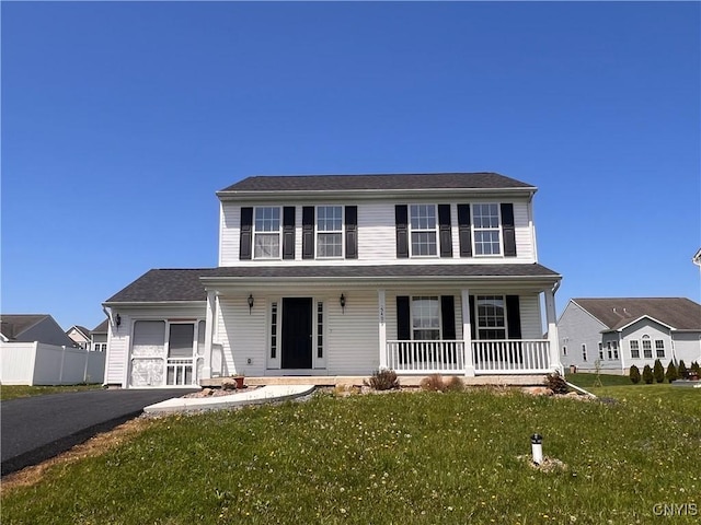 5499 Ravensthorpe, Clay, NY 13041 - colonial-style house featuring covered porch, driveway, and an attached garage