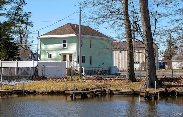 806 Clifford Ave, Vienna, NY 13157 - rear view of house with fence private yard, a water view, and a shingled roof