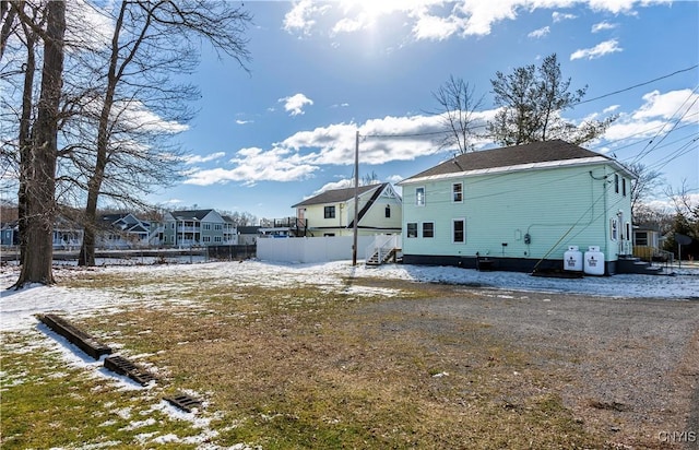 806 Clifford Ave, Vienna, NY 13157 - snow covered back of property with a residential view and entry steps
