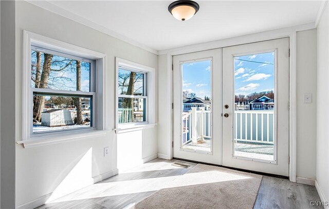 806 Clifford Ave, Vienna, NY 13157 - doorway featuring wood finished floors, french doors, and baseboards