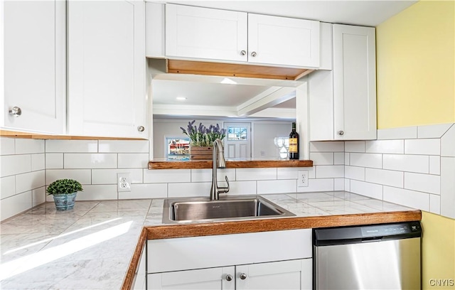 806 Clifford Ave, Vienna, NY 13157 - kitchen featuring a sink, tasteful backsplash, stainless steel dishwasher, and white cabinetry