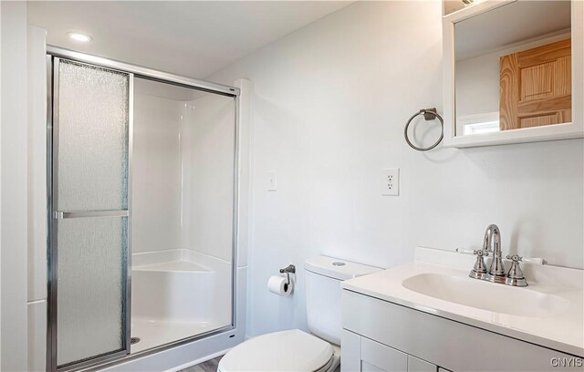 806 Clifford Ave, Vienna, NY 13157 - bathroom with vanity, toilet, and a stall shower
