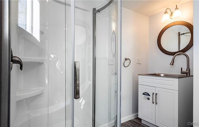806 Clifford Ave, Vienna, NY 13157 - full bathroom featuring a shower stall, vanity, baseboards, and wood finished floors
