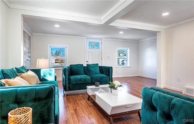 806 Clifford Ave, Vienna, NY 13157 - living area featuring visible vents, baseboards, wood finished floors, and ornamental molding