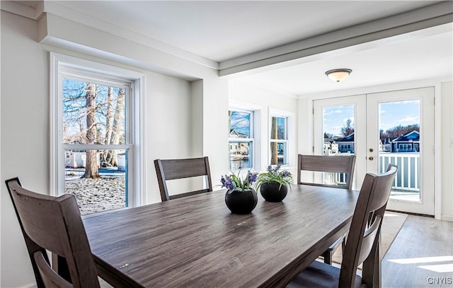 806 Clifford Ave, Vienna, NY 13157 - dining area with a wealth of natural light, french doors, and light wood-style flooring
