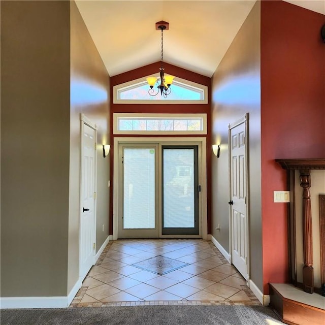919 W Broad St, Horseheads, NY 14845 - foyer entrance featuring baseboards, high vaulted ceiling, light tile patterned floors, and a notable chandelier