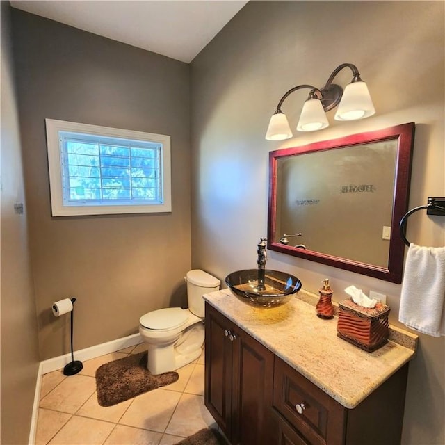 919 W Broad St, Horseheads, NY 14845 - half bathroom with vanity, toilet, tile patterned flooring, and baseboards