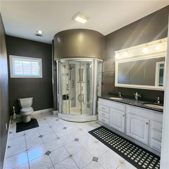 919 W Broad St, Horseheads, NY 14845 - bathroom with double vanity, toilet, a stall shower, and a sink