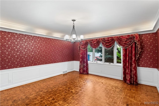 67 Nottingham Ter, Buffalo, NY 14216 - spare room featuring a chandelier, wainscoting, wallpapered walls, and a decorative wall