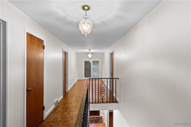 67 Nottingham Ter, Buffalo, NY 14216 - hall with an upstairs landing, a chandelier, and baseboards