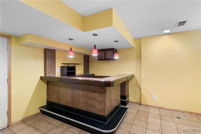 67 Nottingham Ter, Buffalo, NY 14216 - bar area featuring baseboards, tile patterned floors, and decorative light fixtures