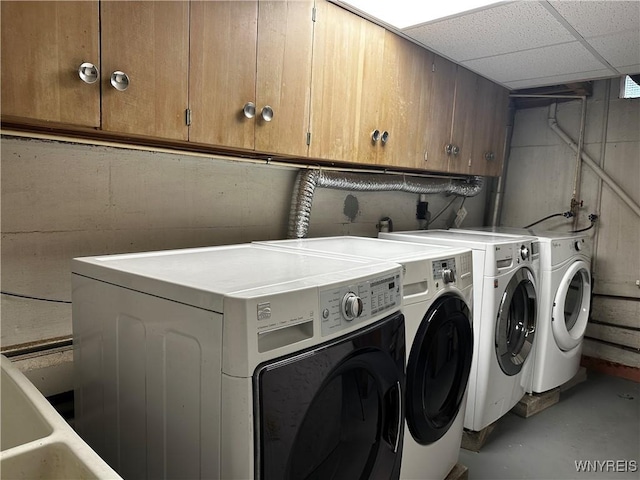 67 Nottingham Ter, Buffalo, NY 14216 - laundry room featuring washer and clothes dryer and cabinet space