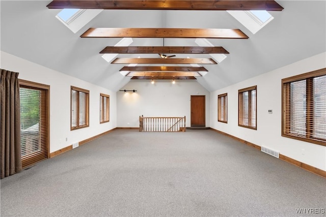 67 Nottingham Ter, Buffalo, NY 14216 - unfurnished living room with a skylight, baseboards, and carpet floors