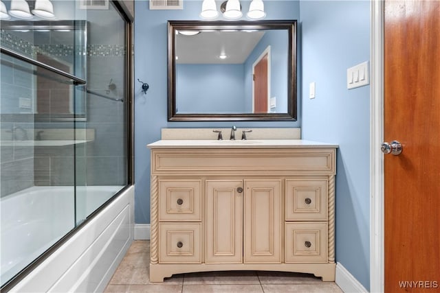 67 Nottingham Ter, Buffalo, NY 14216 - full bath featuring baseboards, vanity, tile patterned flooring, and bath / shower combo with glass door