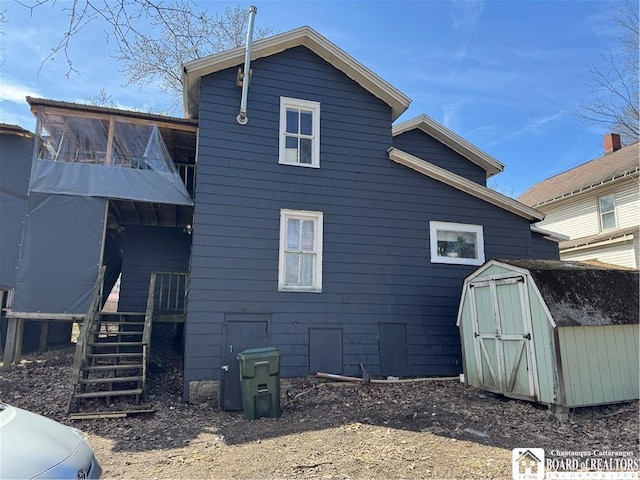 48 Thayer St, Jamestown, NY 14701 - view of home's exterior featuring stairs, an outbuilding, and a shed