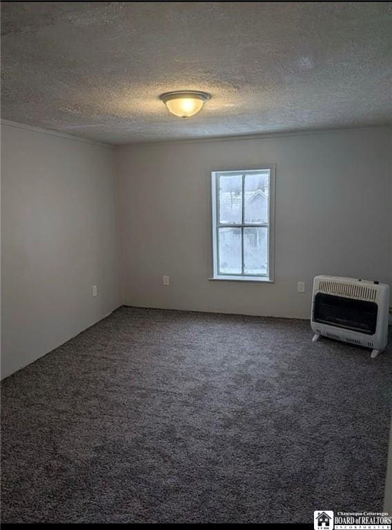 48 Thayer St, Jamestown, NY 14701 - unfurnished room with heating unit, a textured ceiling, and carpet flooring