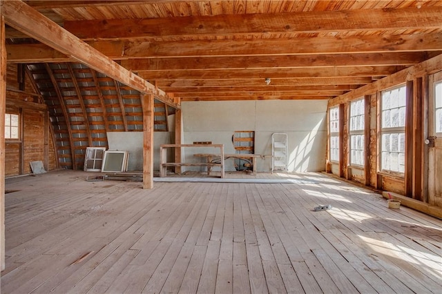 misc room with vaulted ceiling with beams and hardwood / wood-style floors