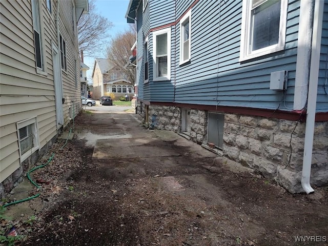 view of property exterior with a residential view