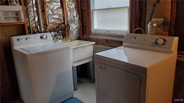 washroom featuring washing machine and dryer and laundry area
