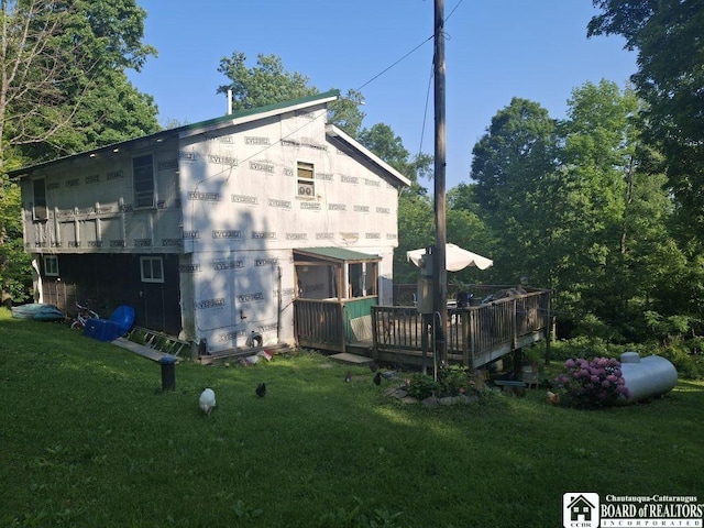 6098 Shady Ln, Lyndon, NY 14737 - back of property with a deck and a yard
