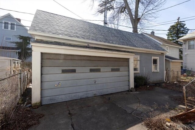 detached garage with fence