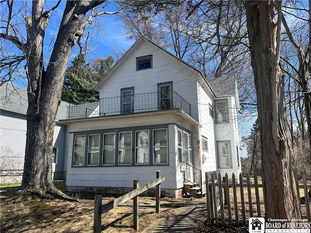 213 S Clinton St, Olean-City, NY 14760 - exterior space with a fenced front yard, entry steps, and a balcony