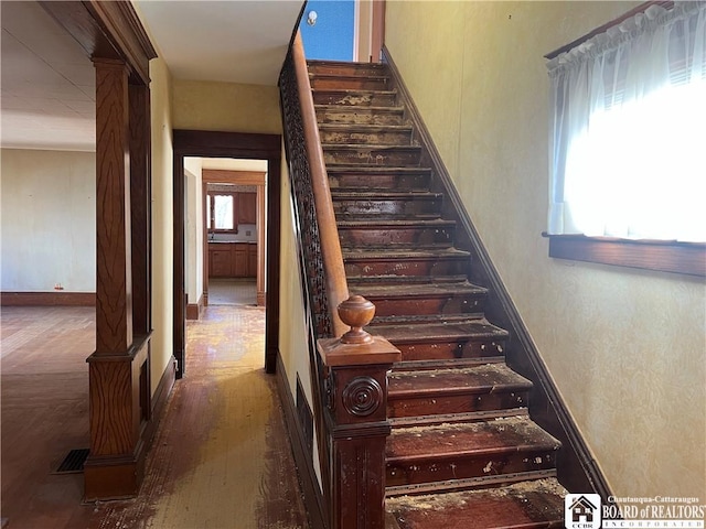 213 S Clinton St, Olean-City, NY 14760 - staircase featuring baseboards and wood finished floors