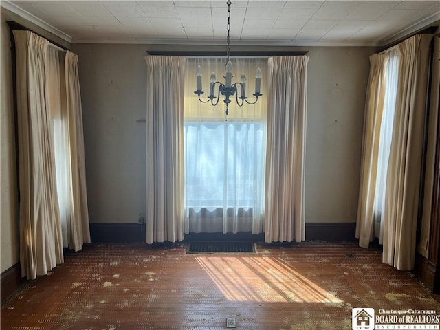 213 S Clinton St, Olean-City, NY 14760 - unfurnished dining area featuring visible vents, baseboards, a notable chandelier, and ornamental molding