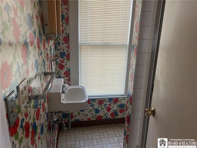 213 S Clinton St, Olean-City, NY 14760 - bathroom featuring a sink, baseboards, and wallpapered walls