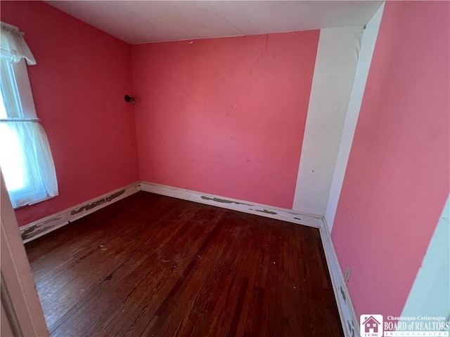 213 S Clinton St, Olean-City, NY 14760 - empty room featuring baseboards and wood finished floors