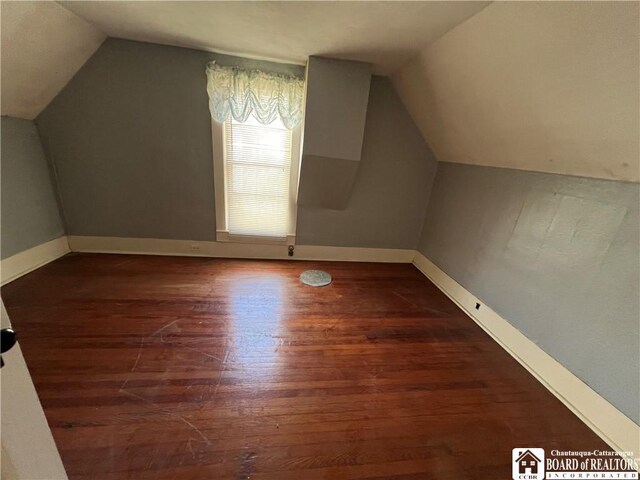 213 S Clinton St, Olean-City, NY 14760 - bonus room featuring baseboards, wood finished floors, and vaulted ceiling