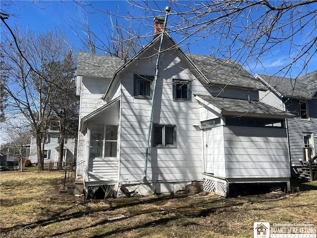 213 S Clinton St, Olean-City, NY 14760 - view of home's exterior with entry steps, roof with shingles, and a chimney