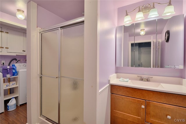 42913 County Route 100, Orleans, NY 13640 - full bathroom with wood finished floors, vanity, washer / dryer, and a shower stall