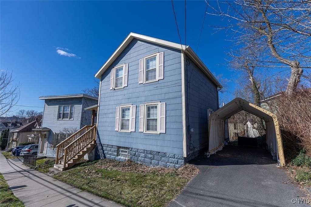 213 Oak St, Syracuse, NY 13203 - view of front of home with aphalt driveway and a carport