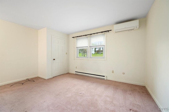 carpeted empty room with a wall mounted air conditioner, a baseboard heating unit, and baseboards